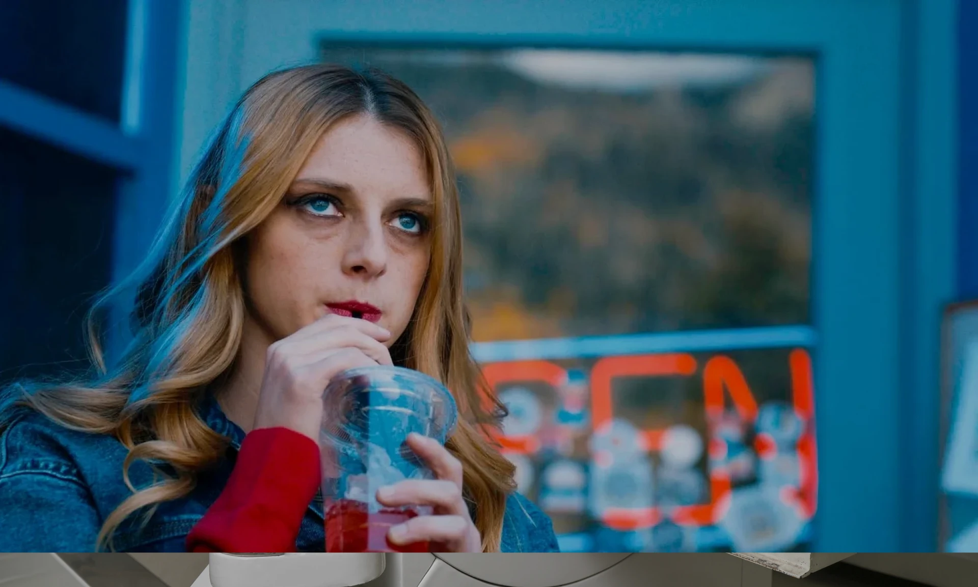 Woman enjoying a beverage outdoors